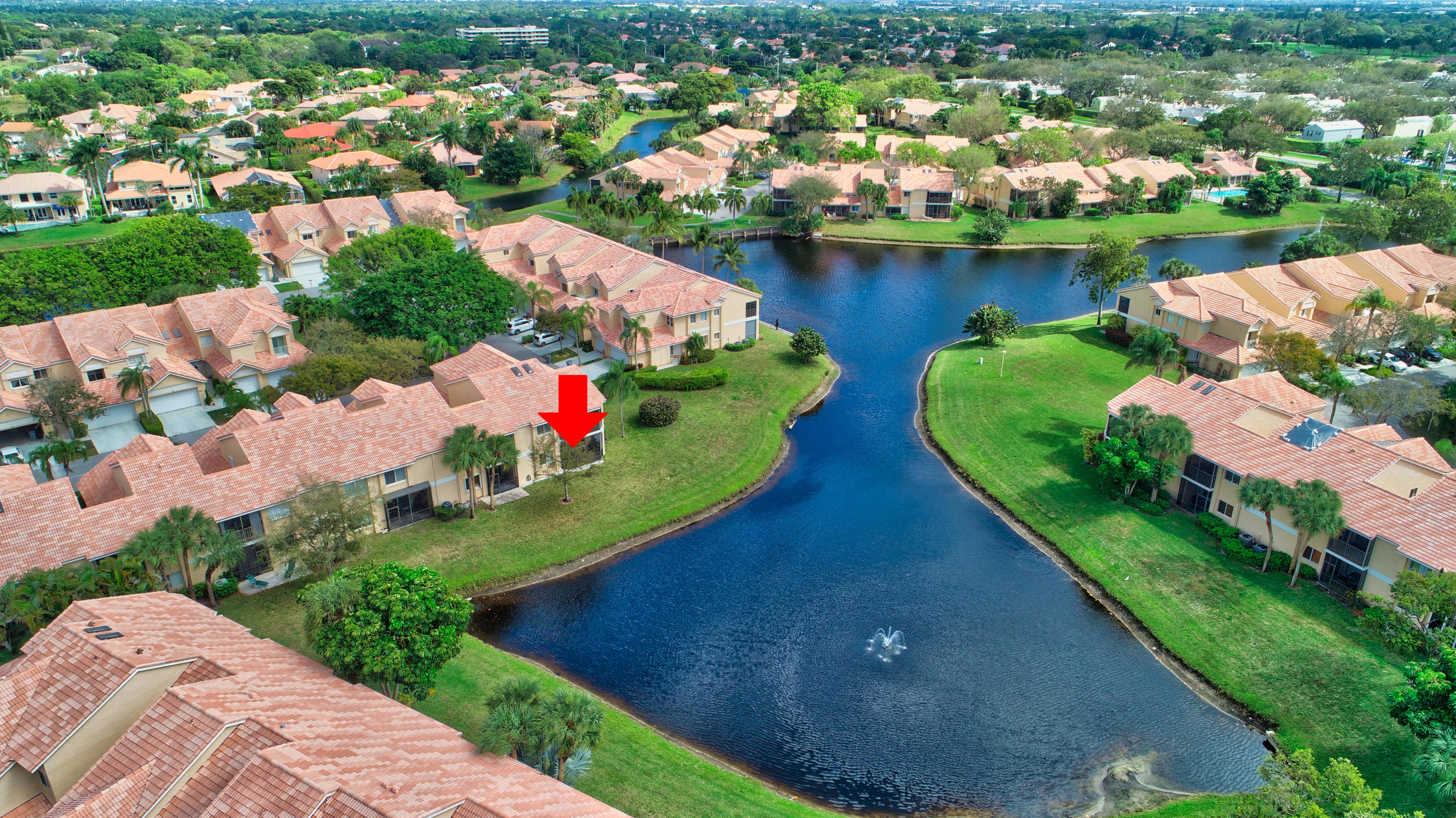 23061 Aqua View, Unit 1 Boca Raton, FL 33433 - Photo 3 of 29 an aerial view of a house with a garden and lake view