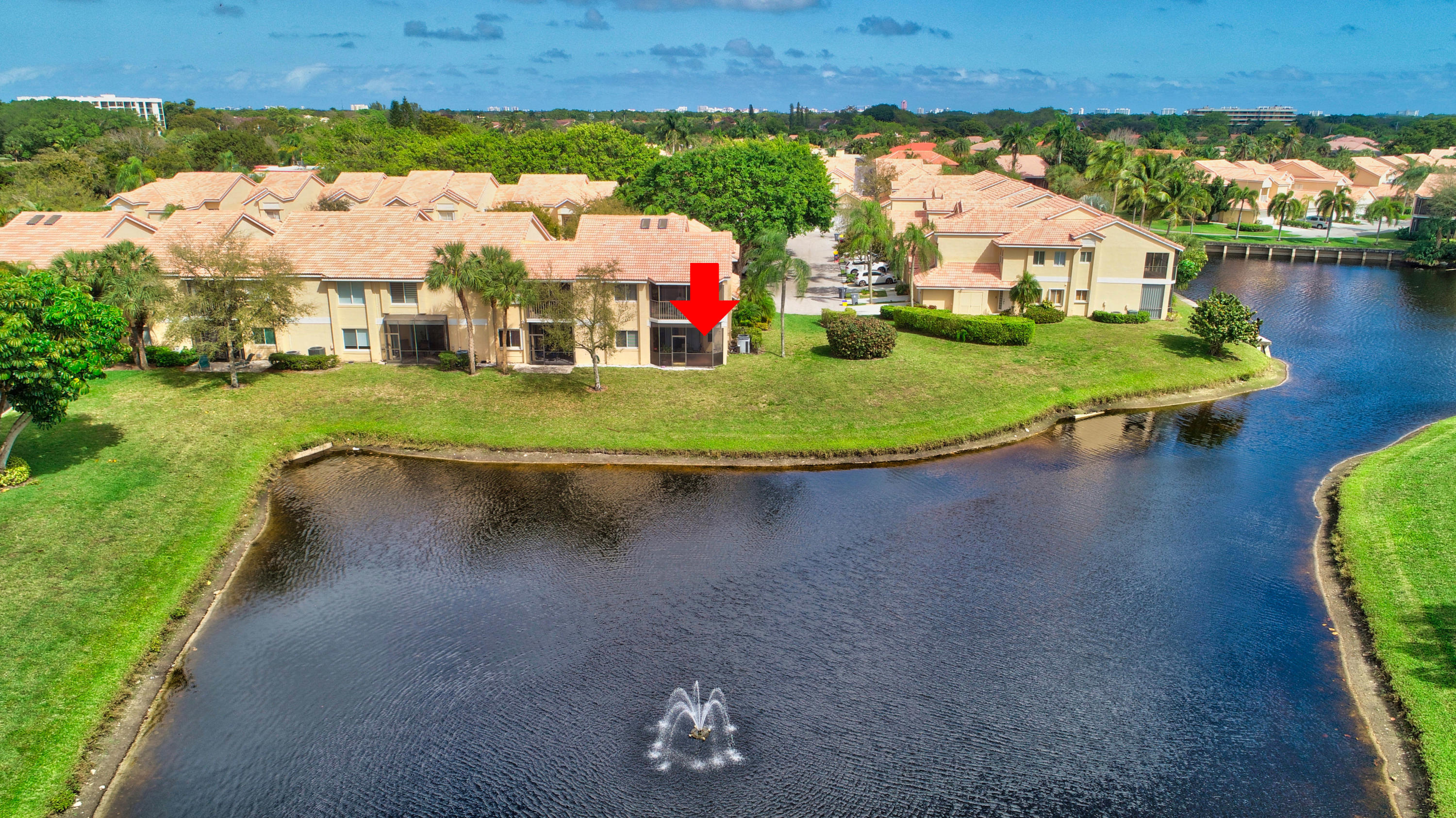 23061 Aqua View, Unit 1 Boca Raton, FL 33433 - Photo 4 of 29 an aerial view of a house with a yard and lake view