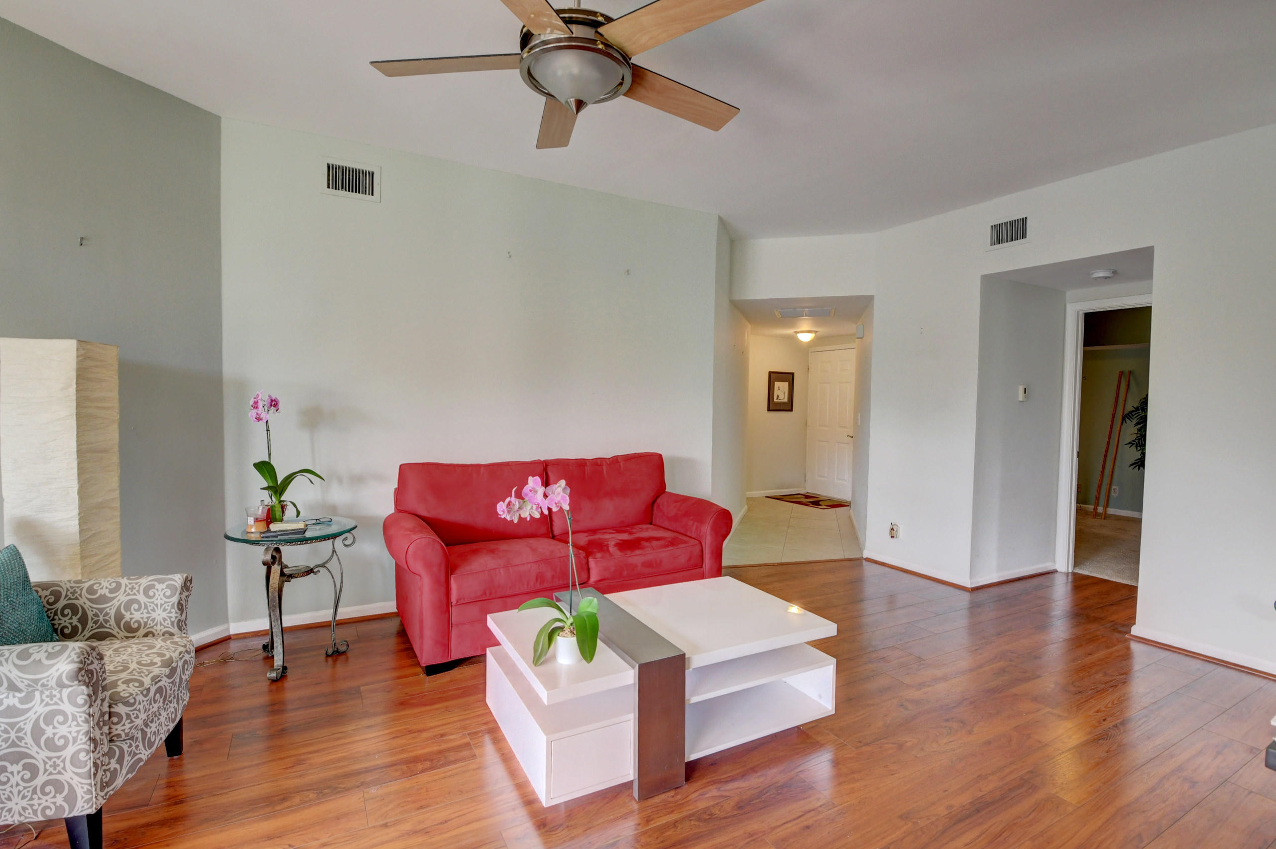 23061 Aqua View, Unit 1 Boca Raton, FL 33433 - Photo 10 of 29 a living room with furniture and a wooden floor