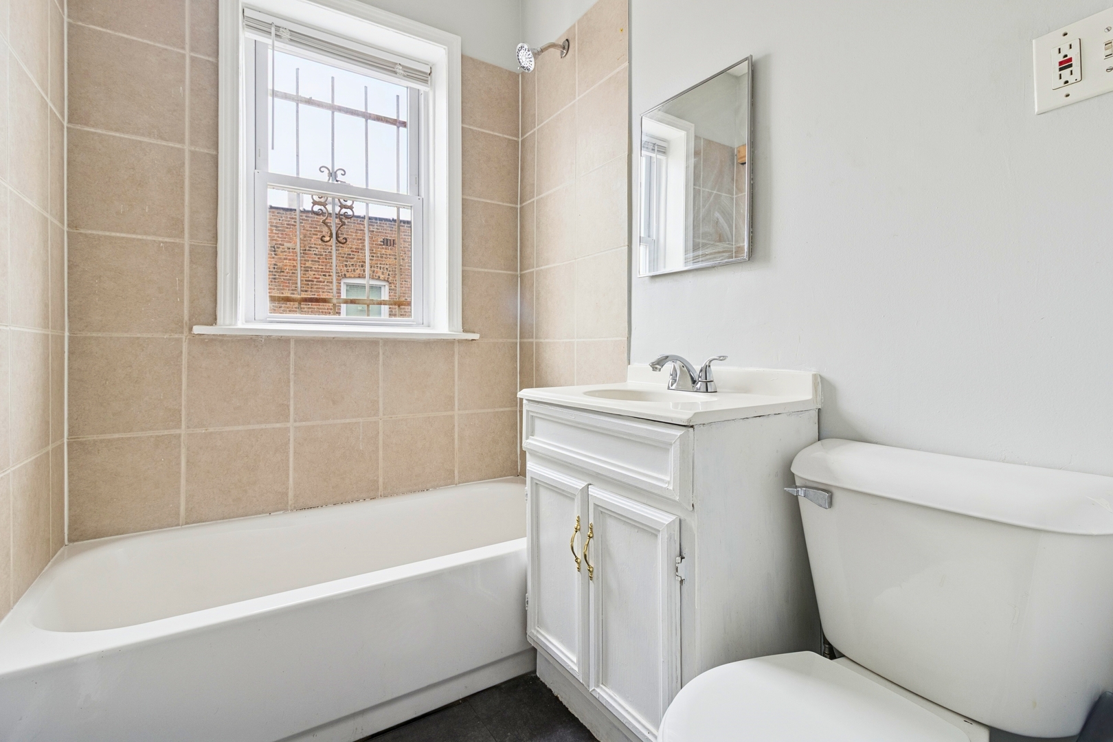 6228 South Western Avenue, Unit 203 Chicago, IL 60636 - Photo 11 of 11 a bathroom with a sink toilet and bathtub