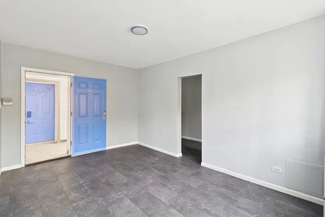 a view of an empty room and closet area