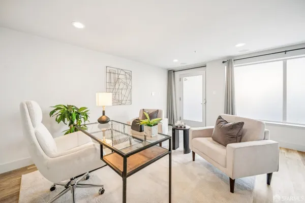 a living room with furniture and a window