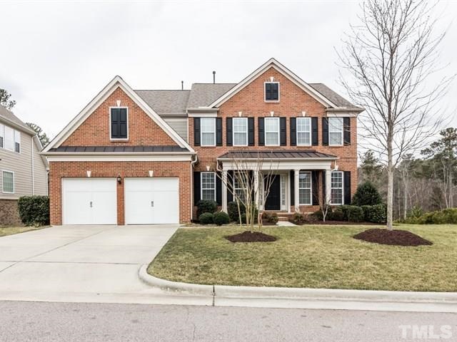 209 Amiable Loop Cary, NC 27519 - Photo 1 of 25 a front view of a house with a yard
