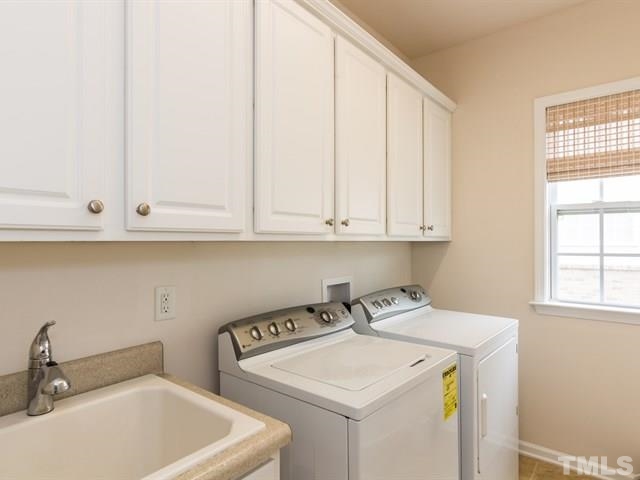 209 Amiable Loop Cary, NC 27519 - Photo 11 of 25 a utility room with dryer and washer