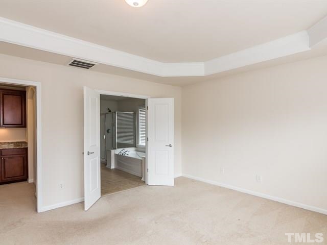 209 Amiable Loop Cary, NC 27519 - Photo 14 of 25 an empty room with a bathroom and a sink