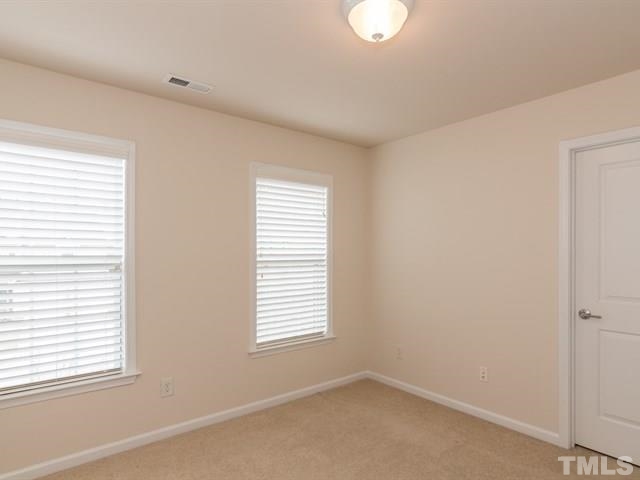 209 Amiable Loop Cary, NC 27519 - Photo 17 of 25 a room and window in a room
