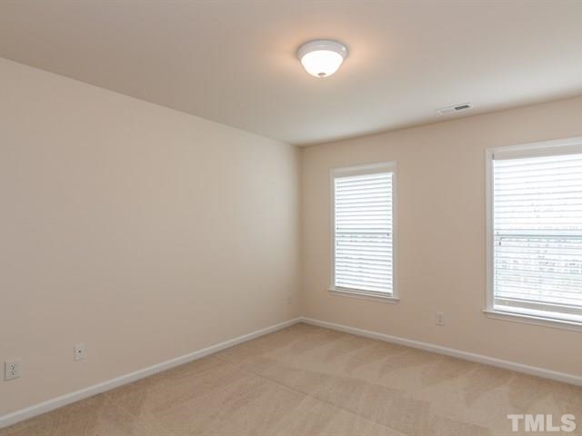 209 Amiable Loop Cary, NC 27519 - Photo 19 of 25 an empty room with windows