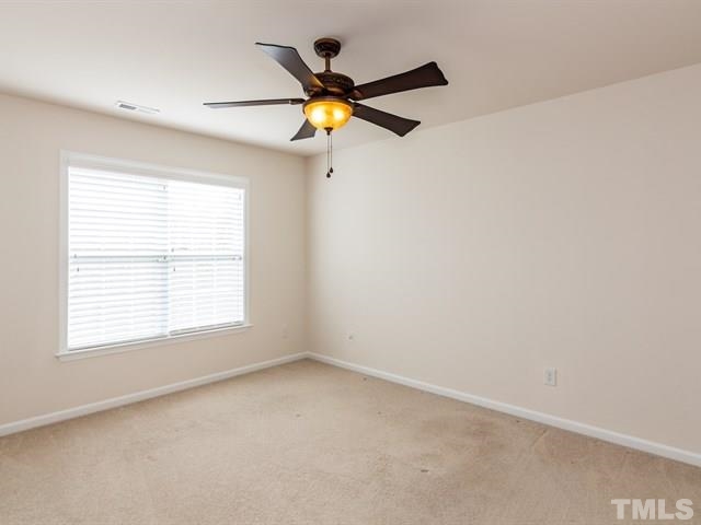 209 Amiable Loop Cary, NC 27519 - Photo 20 of 25 an a room with a window and a ceiling fan