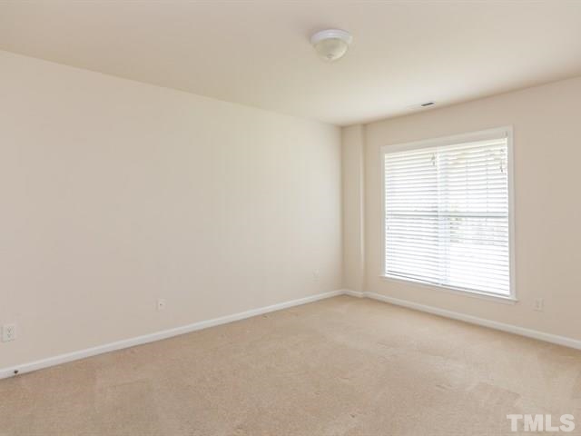 209 Amiable Loop Cary, NC 27519 - Photo 21 of 25 an empty room with a window