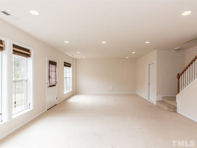 209 Amiable Loop Cary, NC 27519 - Photo 23 of 25 en empty room with windows