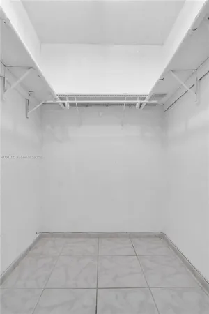 a view of an empty walk in closet