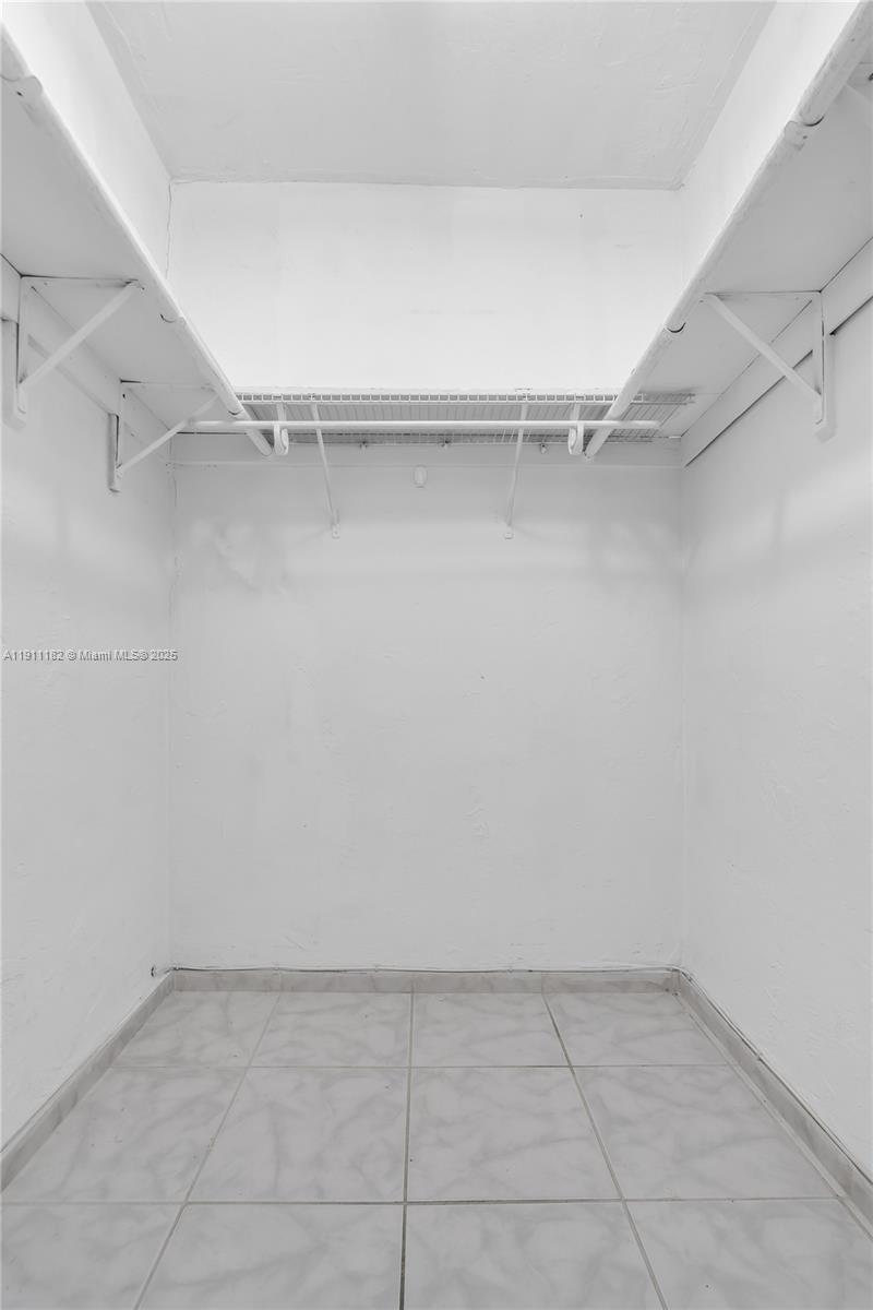 1330 West 54th Street, Unit 302C Hialeah, FL 33012 - Photo 15 of 20 a view of an empty walk in closet