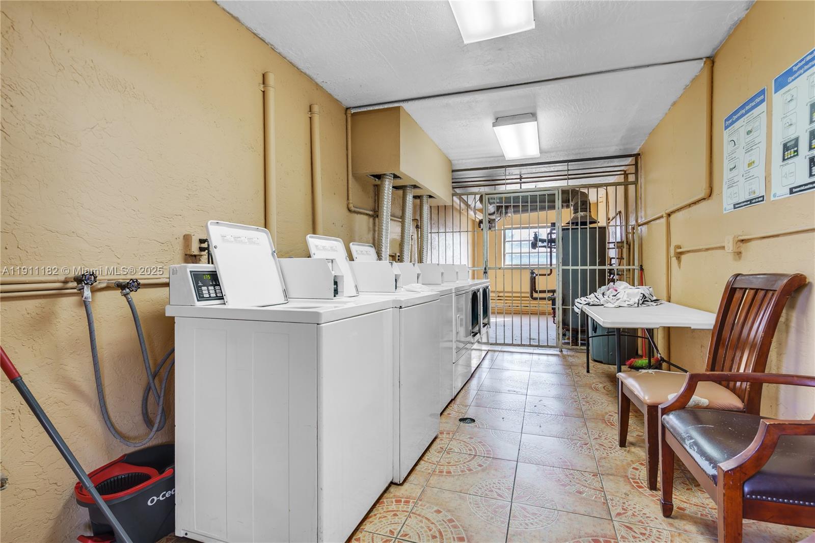 1330 West 54th Street, Unit 302C Hialeah, FL 33012 - Photo 20 of 20 a utility room with multiple dryer and washer