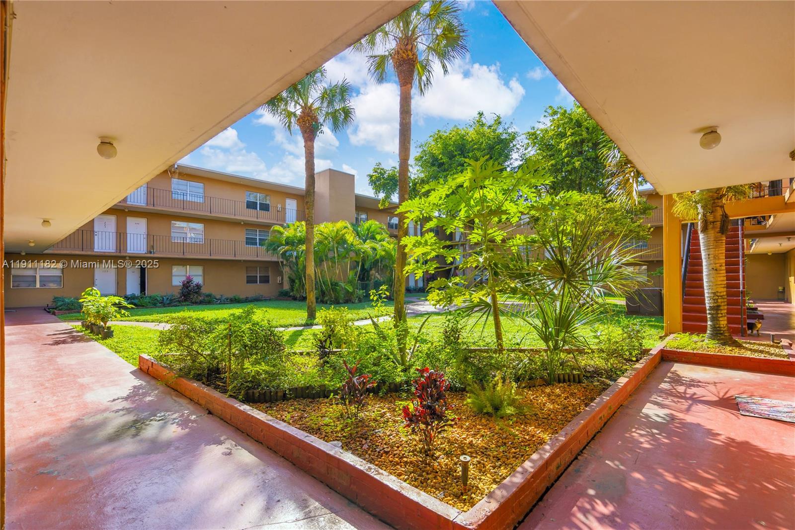 1330 West 54th Street, Unit 302C Hialeah, FL 33012 - Photo 2 of 20 a view of a yard with a wooden fence