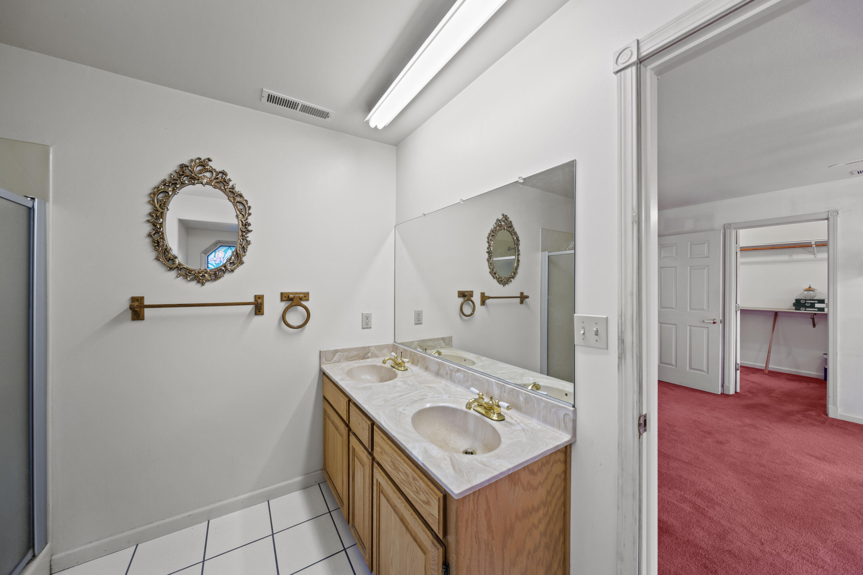21110 Rolling Hills Road Manton, CA 96059 - Photo 11 of 34 a bathroom with a sink mirror and vanity