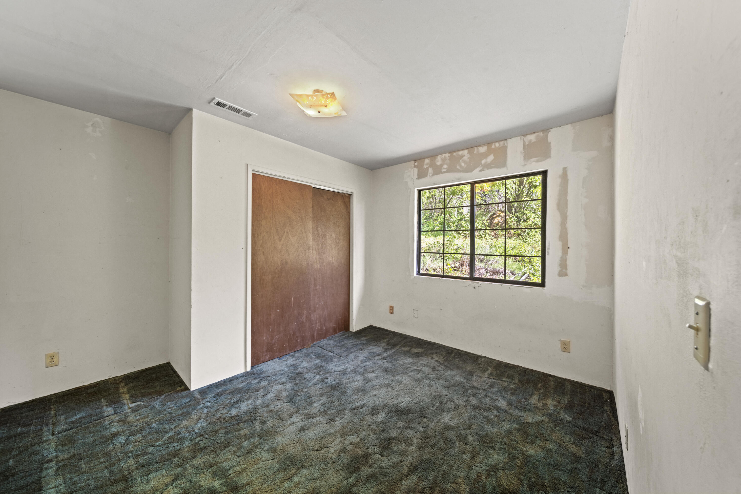 21110 Rolling Hills Road Manton, CA 96059 - Photo 13 of 34 a view of an empty room with a window