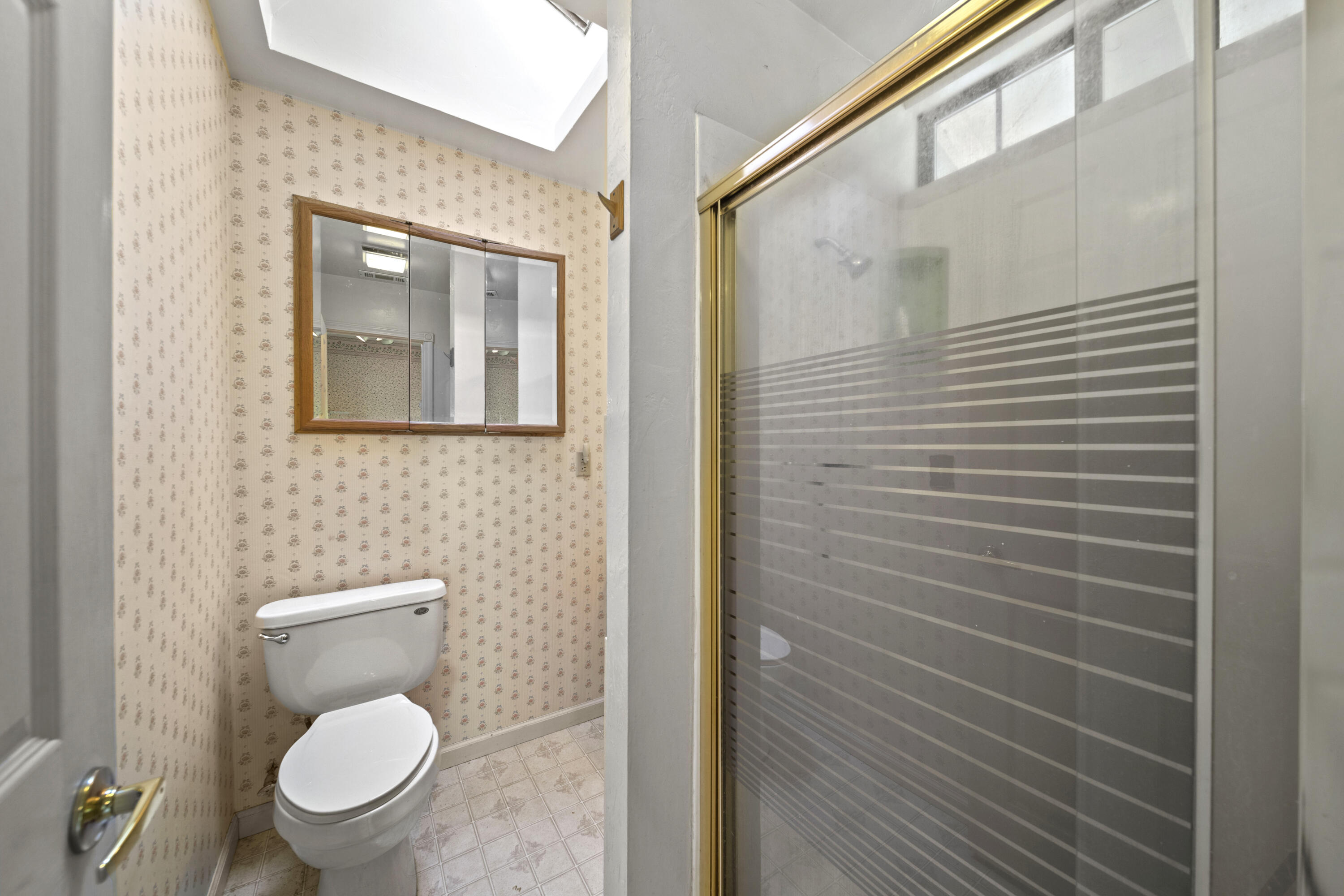 21110 Rolling Hills Road Manton, CA 96059 - Photo 14 of 34 a bathroom with a toilet and a shower