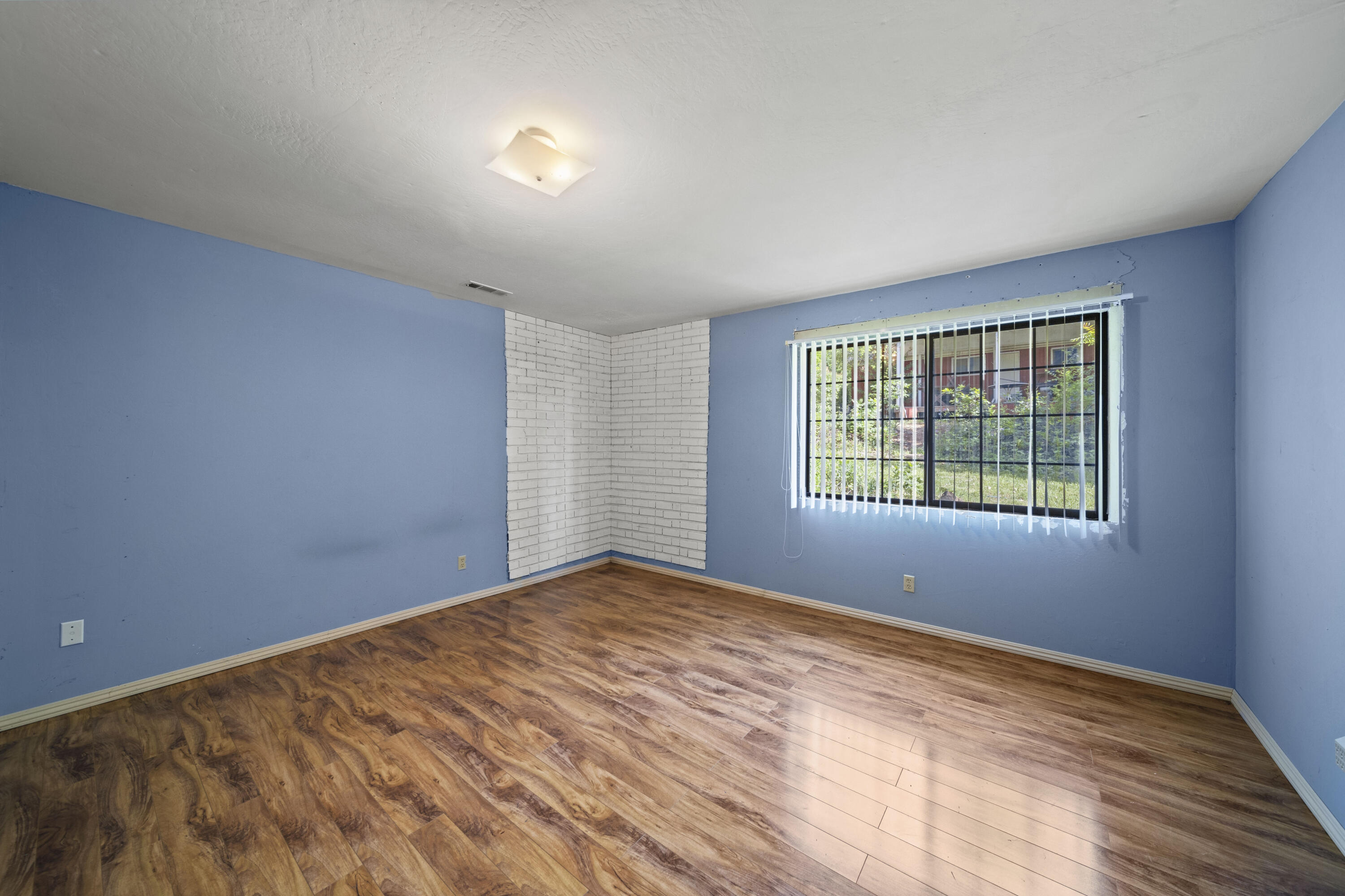 21110 Rolling Hills Road Manton, CA 96059 - Photo 18 of 34 a view of an empty room with a window
