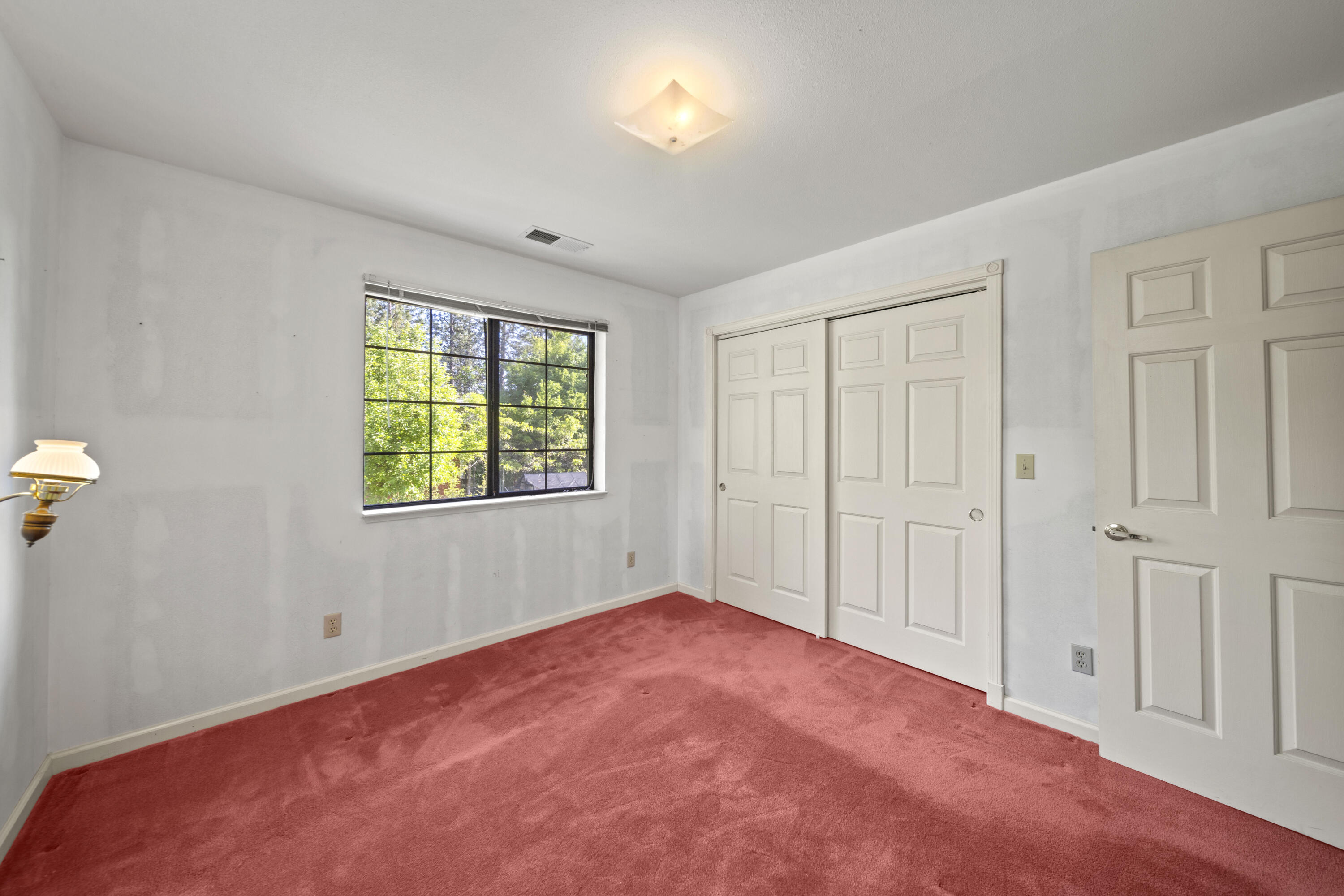 21110 Rolling Hills Road Manton, CA 96059 - Photo 19 of 34 a view of an empty room with a window