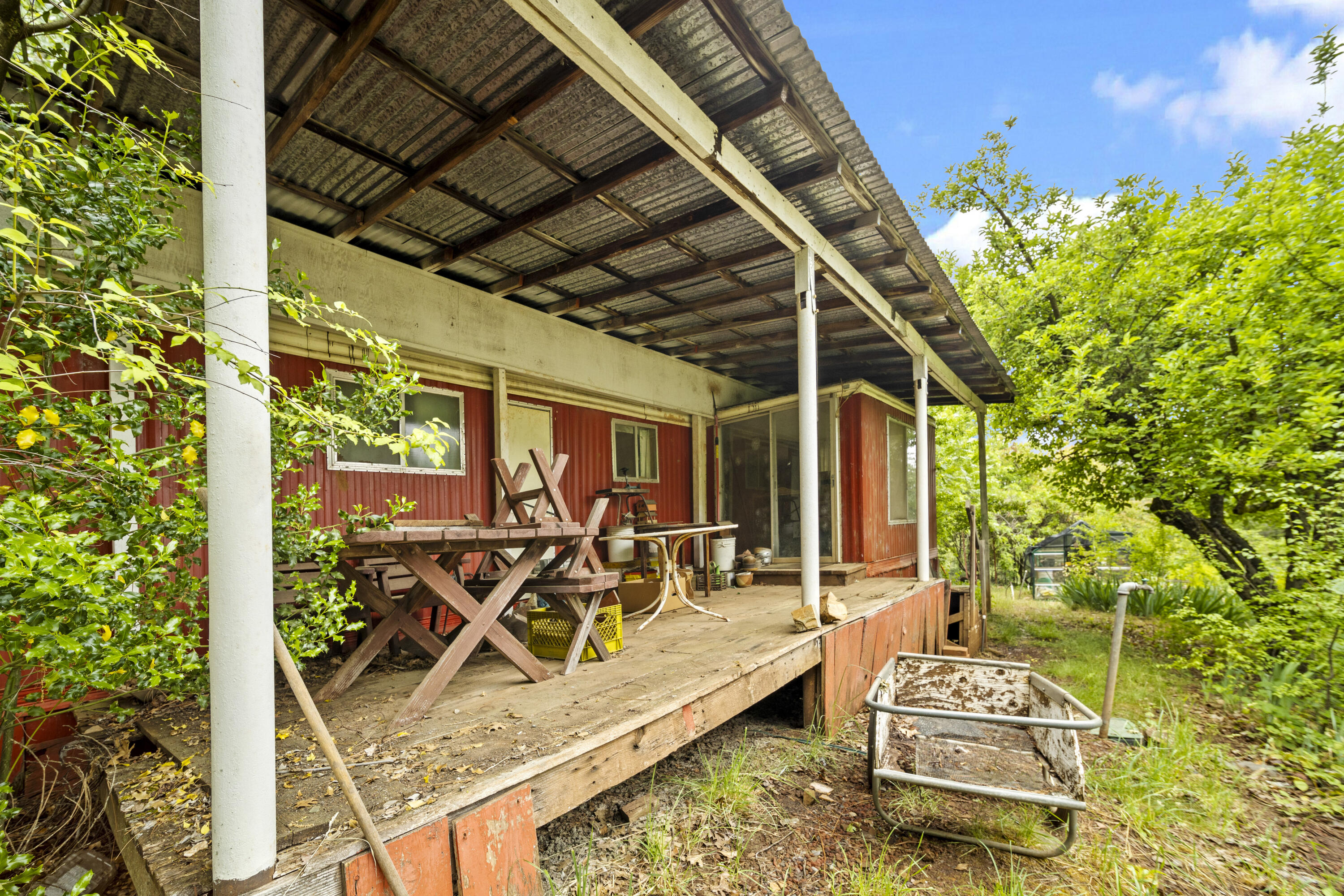 21110 Rolling Hills Road Manton, CA 96059 - Photo 30 of 34 a view of a patio with table and chairs and potted plants