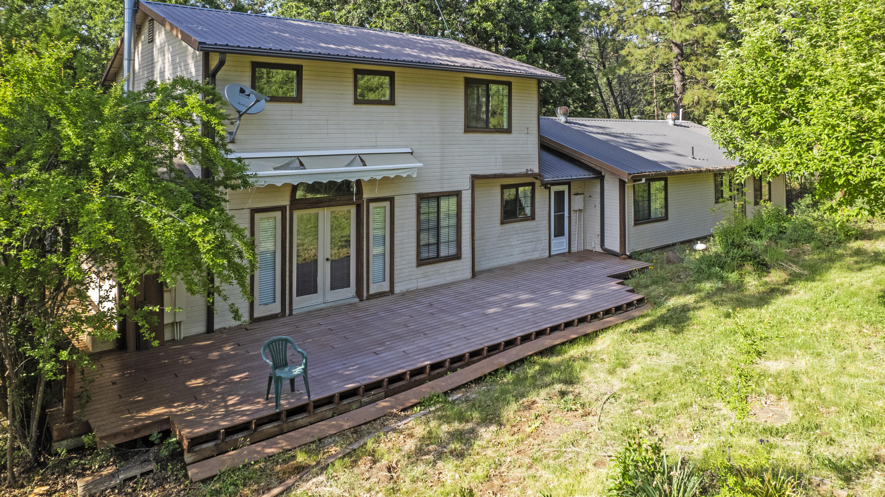 21110 Rolling Hills Road Manton, CA 96059 - Photo 34 of 34 a view of a house with a yard and sitting area