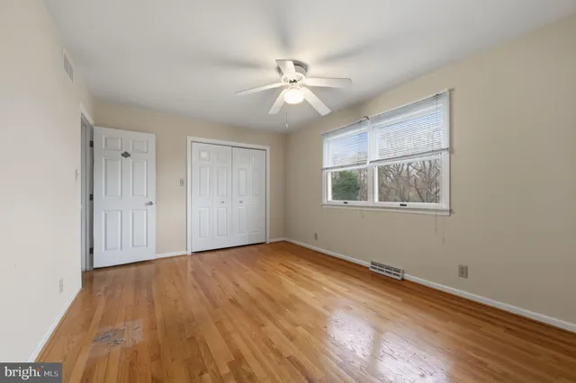 a large bathroom with a large mirror vanity and double