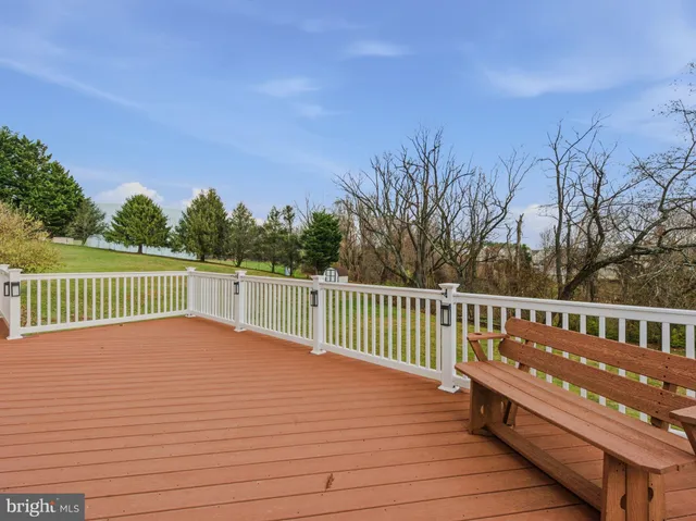 an aerial view of a house with swimming pool and lake view