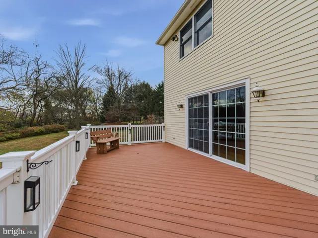 an aerial view of residential house with outdoor space and swimming pool