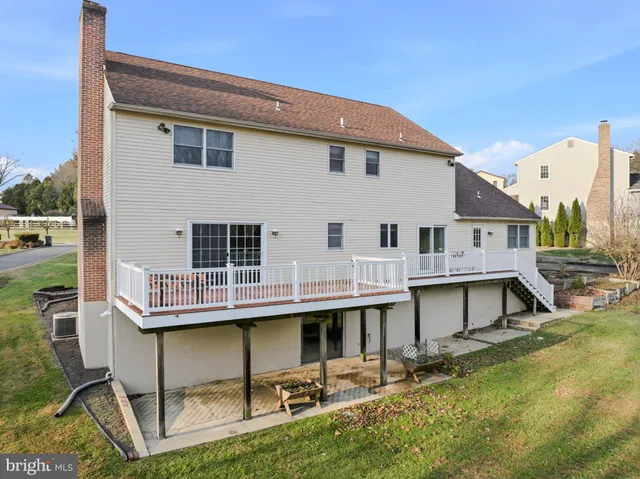an aerial view of a house with outdoor space lake view