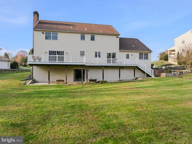 a view of lake from balcony with outdoor seating