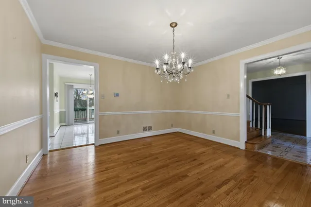 a large kitchen with stainless steel appliances granite countertop a stove and cabinets