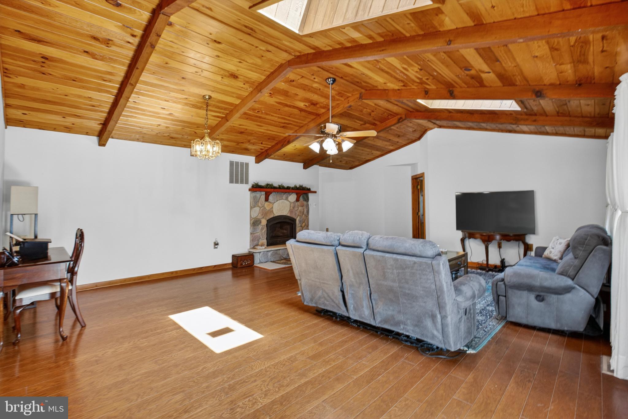 14575 Honeysuckle Way Issue, MD 20645 - Photo 23 of 49 a living room with furniture and a flat screen tv