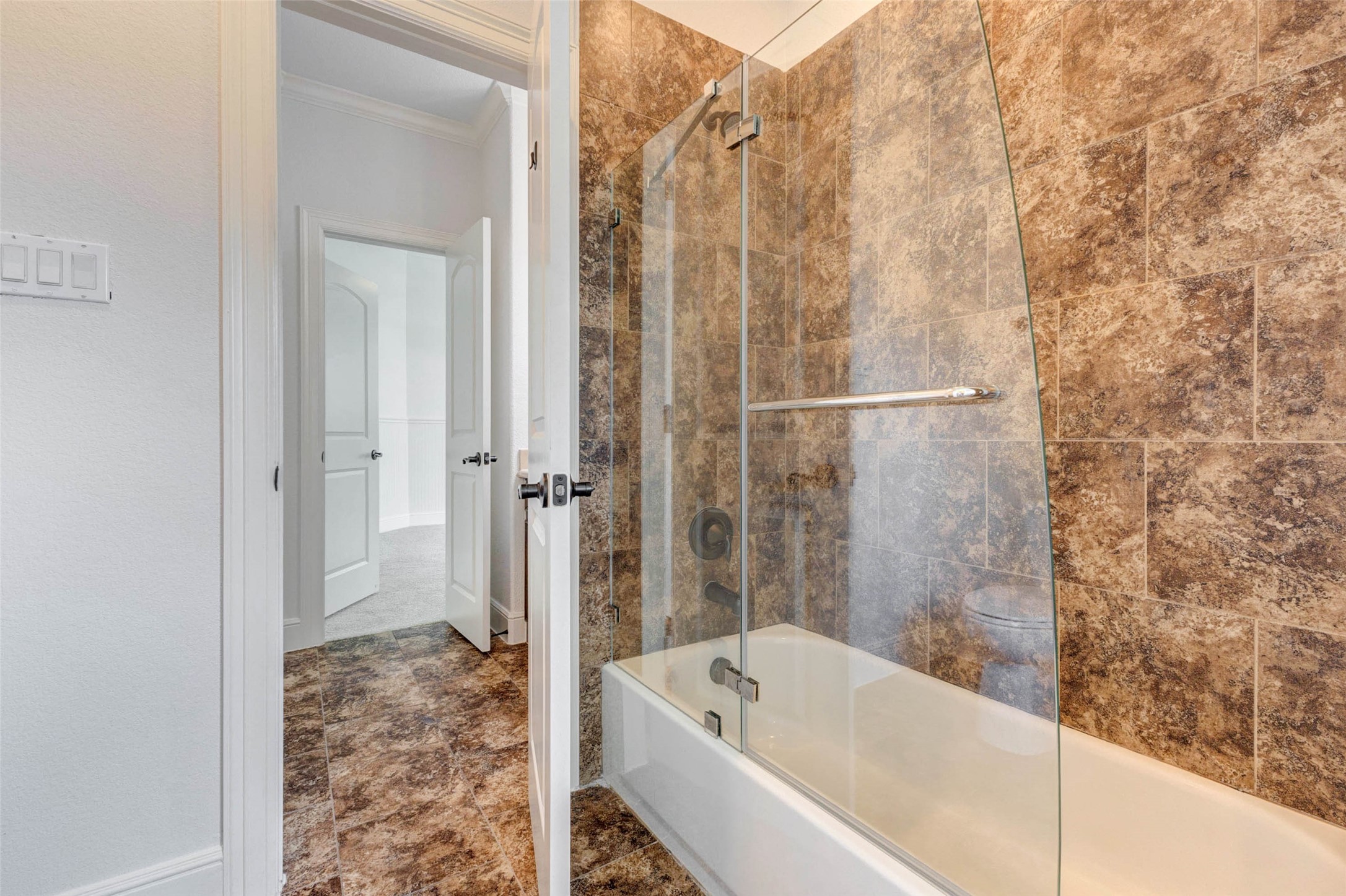 5327 Whitmore Fulshear, TX 77441 - Photo 34 of 50 The adjoining bath features a tub/shower combination and timeless finishes, comfortably serving family members and guests alike.