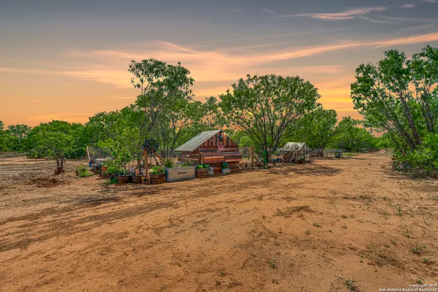 a pathway of a house with a yard