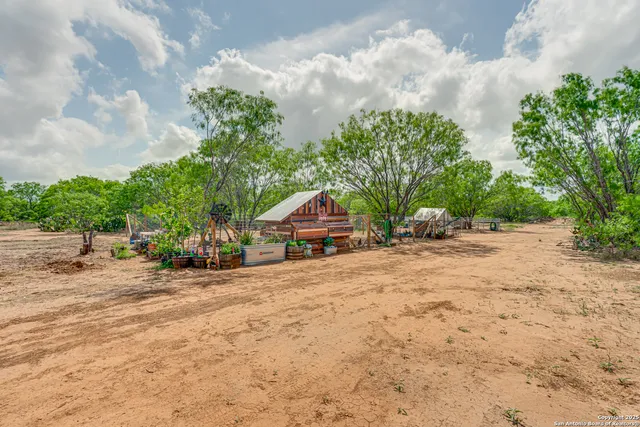a pathway of a house with a yard