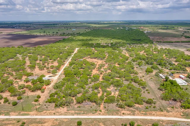 a view of a field with an outdoor space