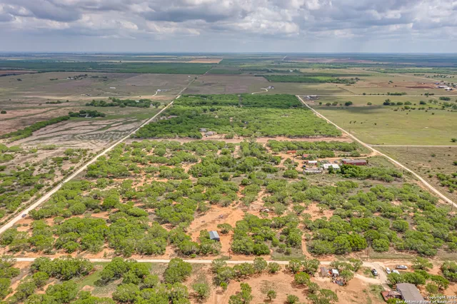 a view of a field with an ocean view