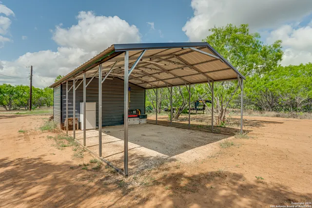 a view of a couches under an umbrella