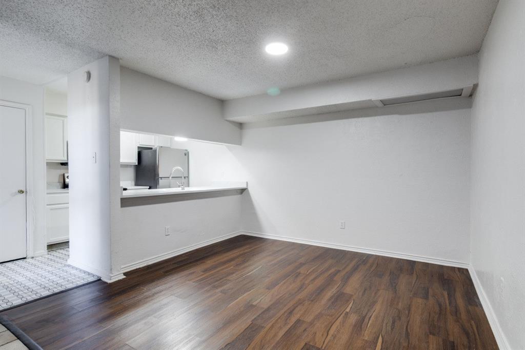 11311 Audelia Road, Unit 239 Dallas, TX 75243 - Photo 9 of 12 a view of empty room with wooden floor