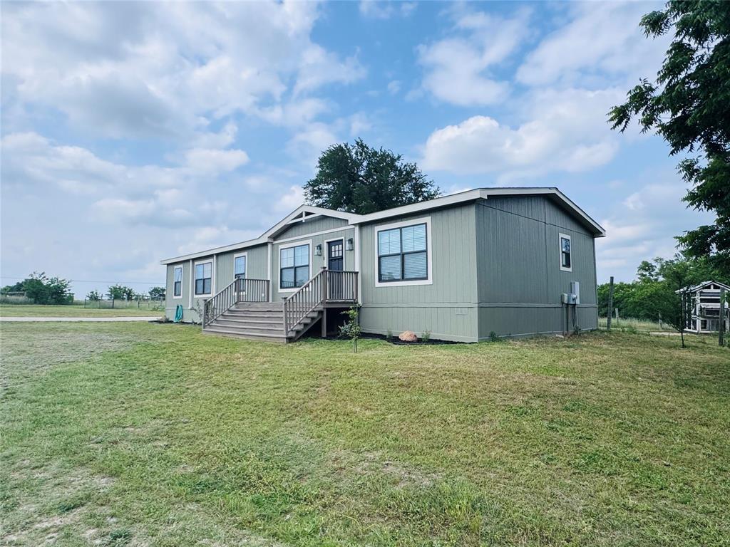 7268 Brangus Road Anna, TX 75409 - Photo 1 of 21 a view of a house with backyard and garden