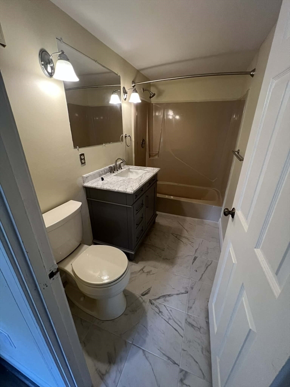 16 Winter Street, Unit 41C Waltham, MA 02451 - Photo 16 of 25 a bathroom with a sink and mirror