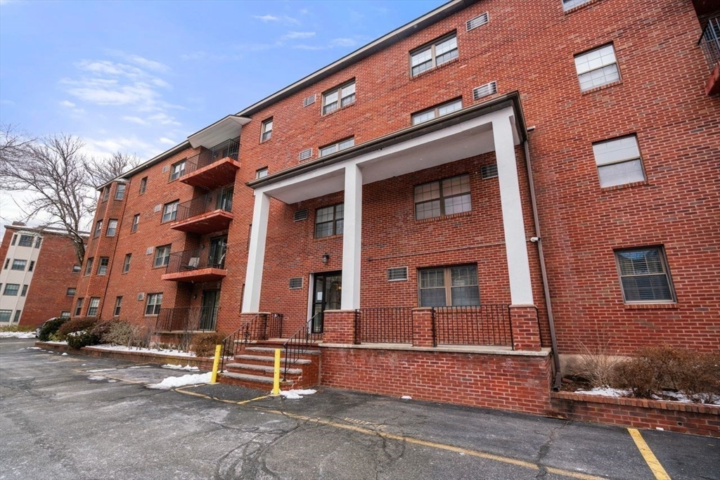16 Winter Street, Unit 41C Waltham, MA 02451 - Photo 22 of 25 a front view of a building with street
