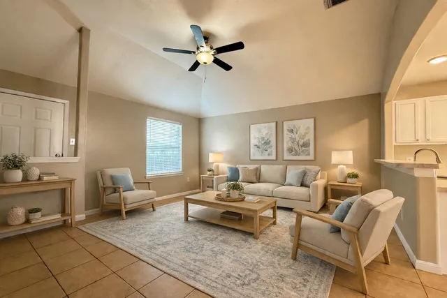 a living room with furniture and a window