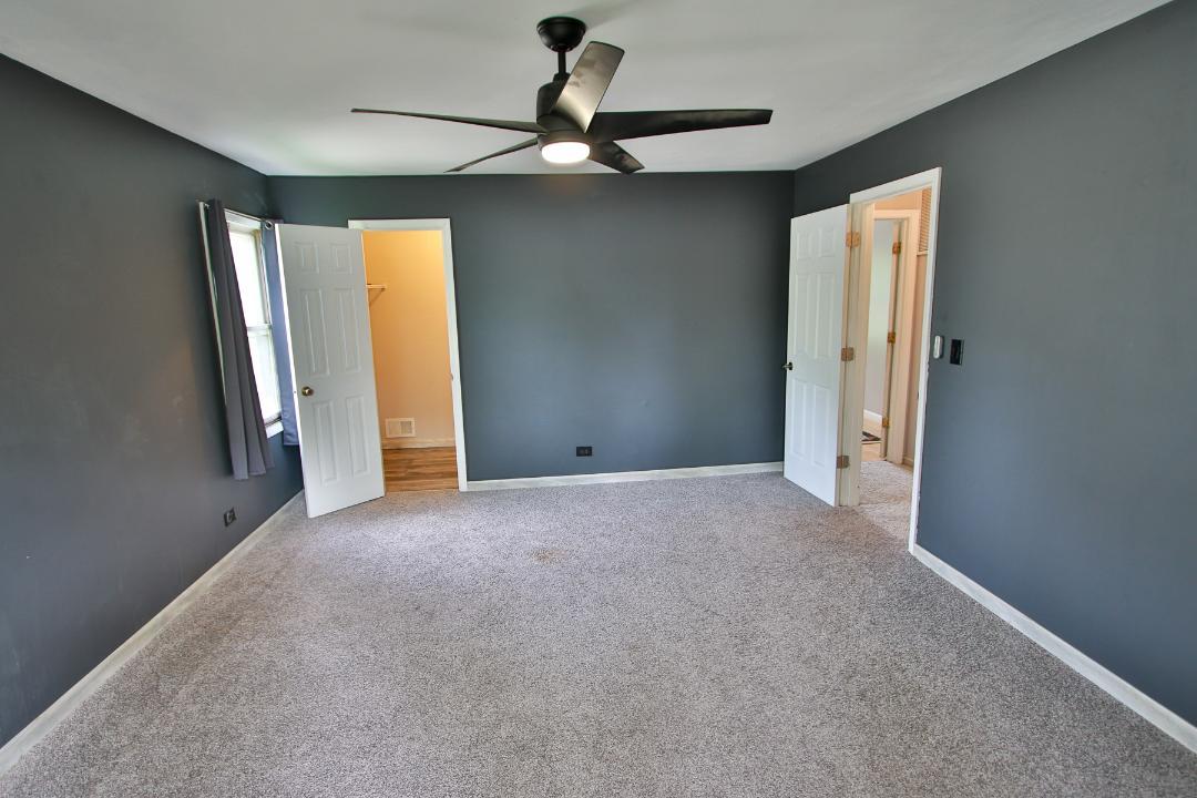 1189 Cumberland Road Aurora, IL 60504 - Photo 13 of 23 a view of a room with a ceiling fan and bathroom