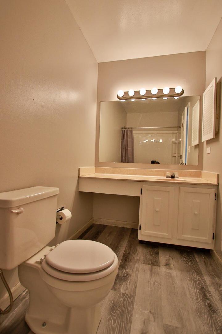 1189 Cumberland Road Aurora, IL 60504 - Photo 19 of 23 a bathroom with a toilet a sink and mirror