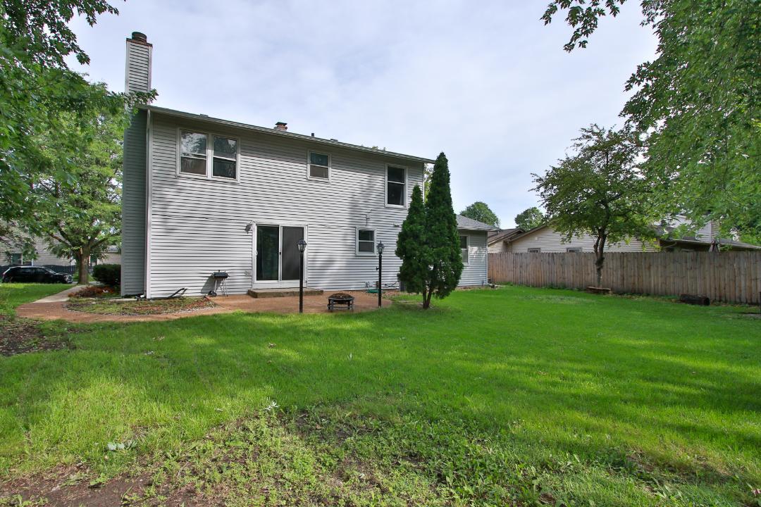 1189 Cumberland Road Aurora, IL 60504 - Photo 21 of 23 a view of a backyard with a garden and plants