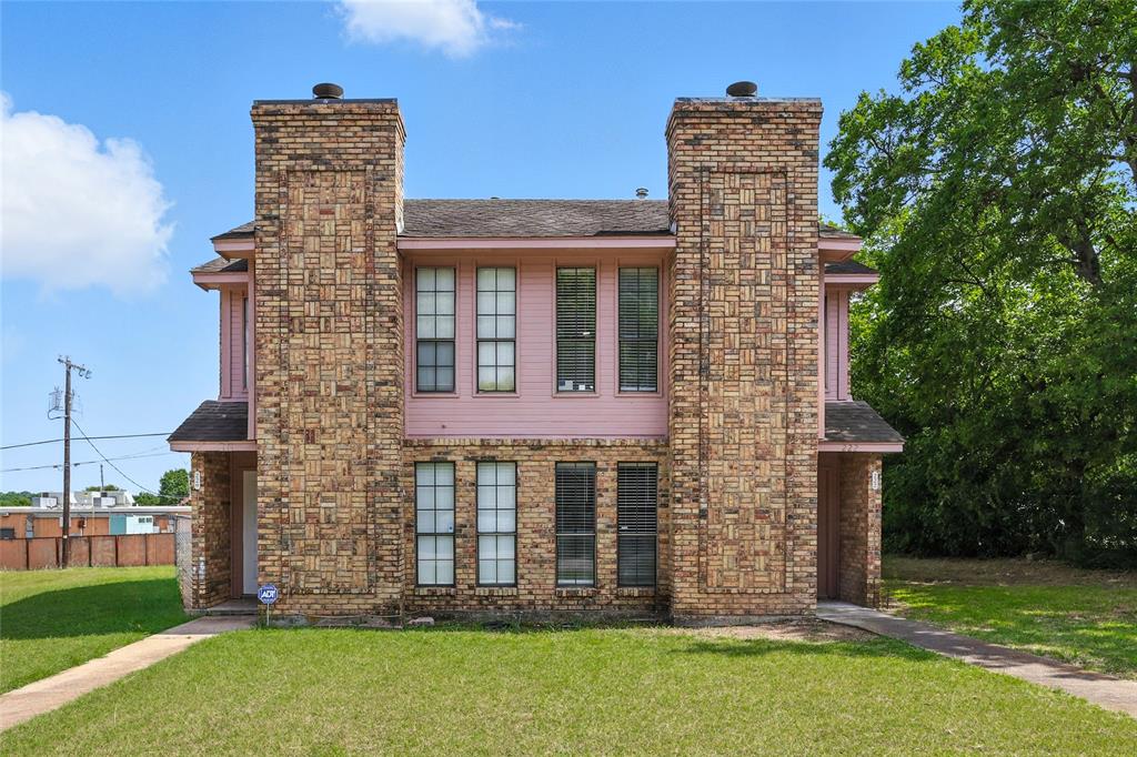 front view of a house with a garden