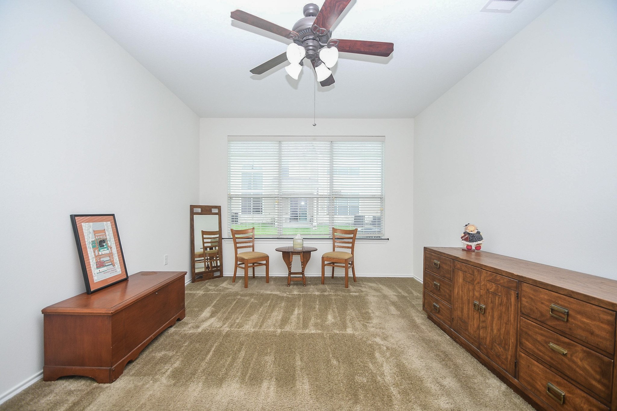 13600 Breton Ridge Street, Unit 36F Houston, TX 77070 - Photo 23 of 38 Spacious primary bedroom featuring abundant natural light.