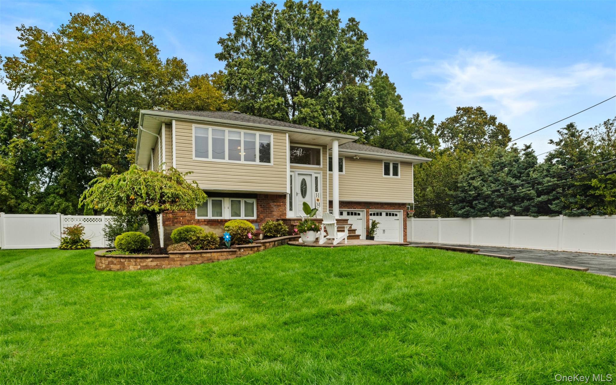 a front view of house with yard and outdoor seating