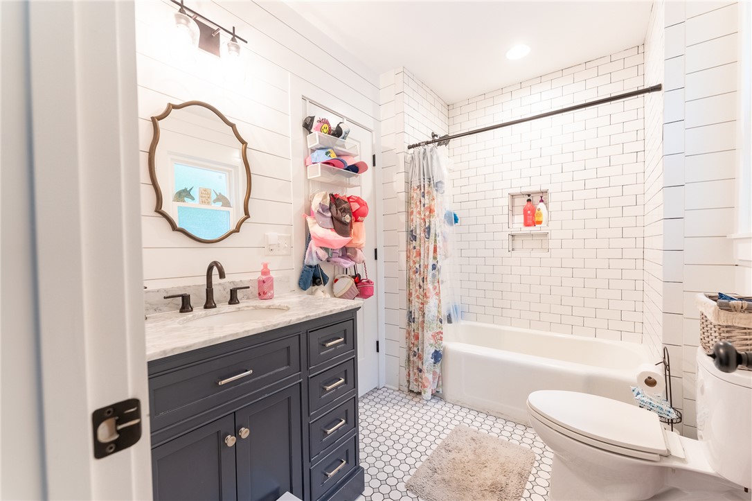 103 Riggs Drive Clemson, SC 29631 - Photo 26 of 50 Crisp white subway tile accents this charming bathroom, featuring a stylish vanity with ample storage.